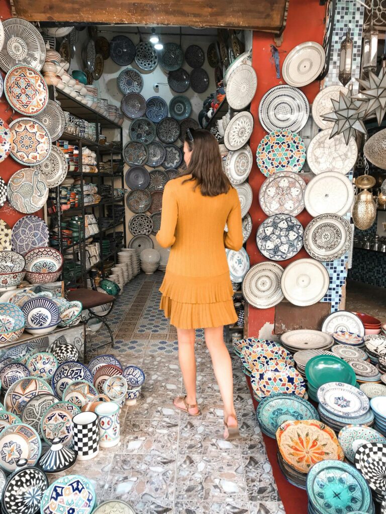 Woman in Ceramic Plates Shop